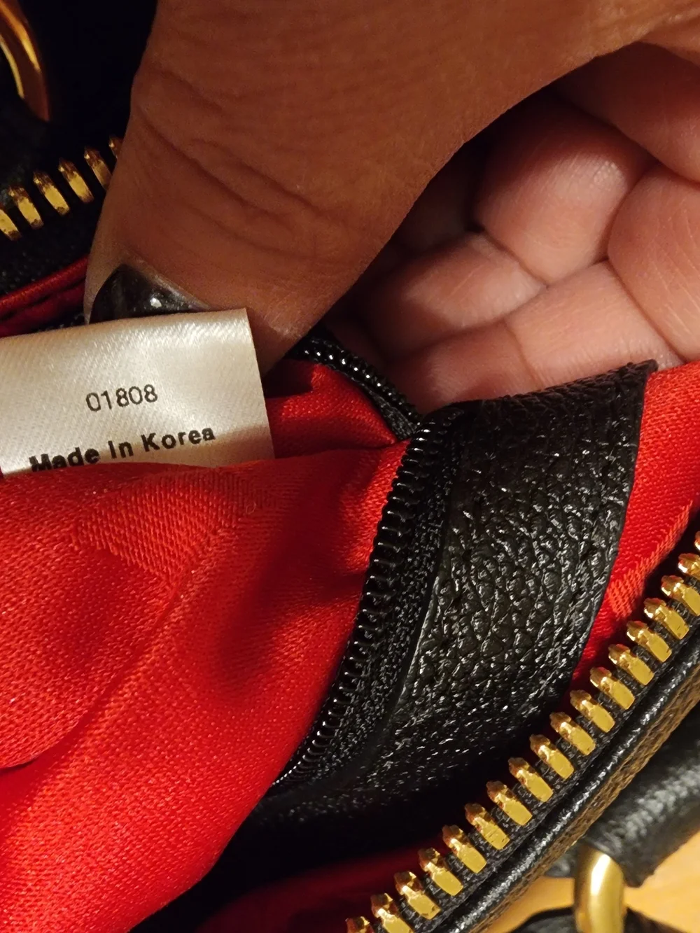 MCM Black Leather Boston Bag featuring polished gold-tone hardware
